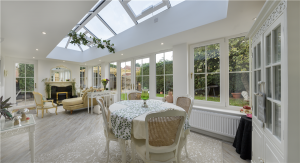 Modern orangery extension in a Cambridge home with glass roof lantern.