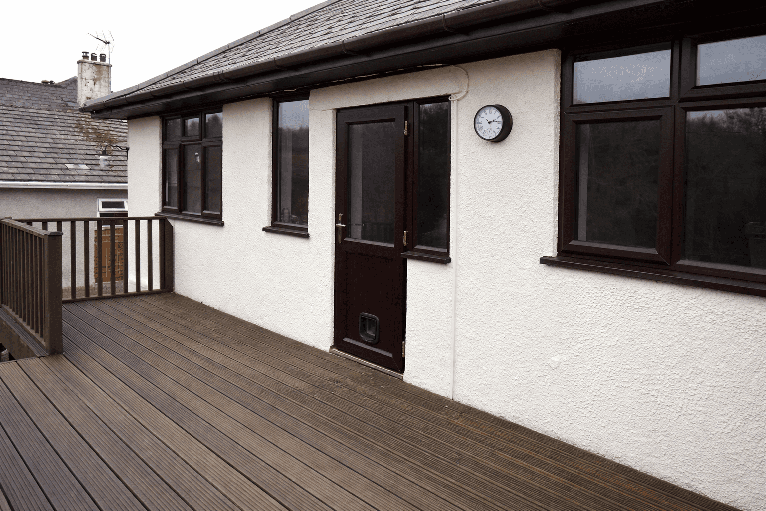 Rosegold uPVC back door with cat flap installed in a residential extension
