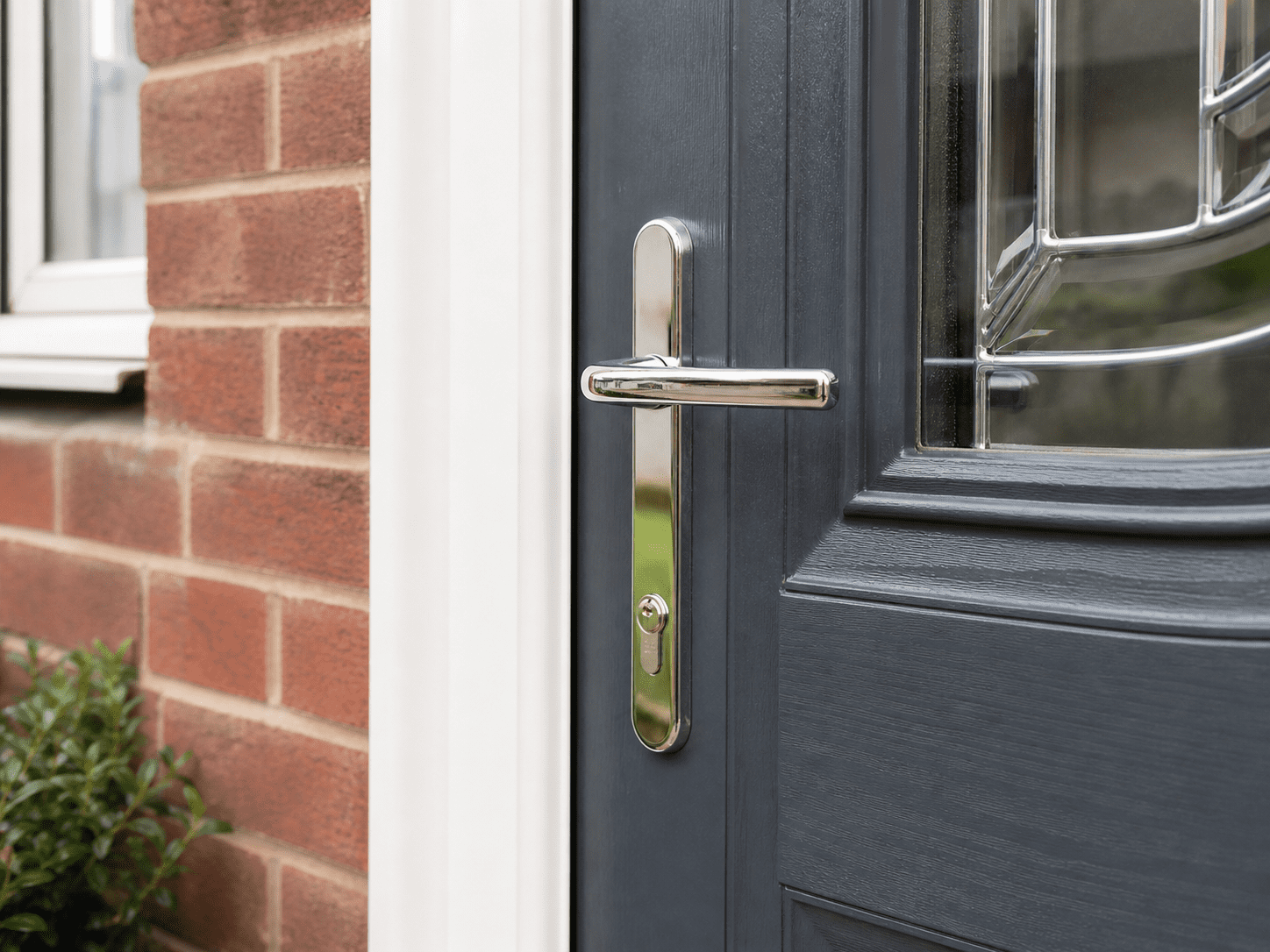 Close-up of a modern uPVC door handle on a UK front door